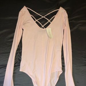 brand new pale pink bodysuit